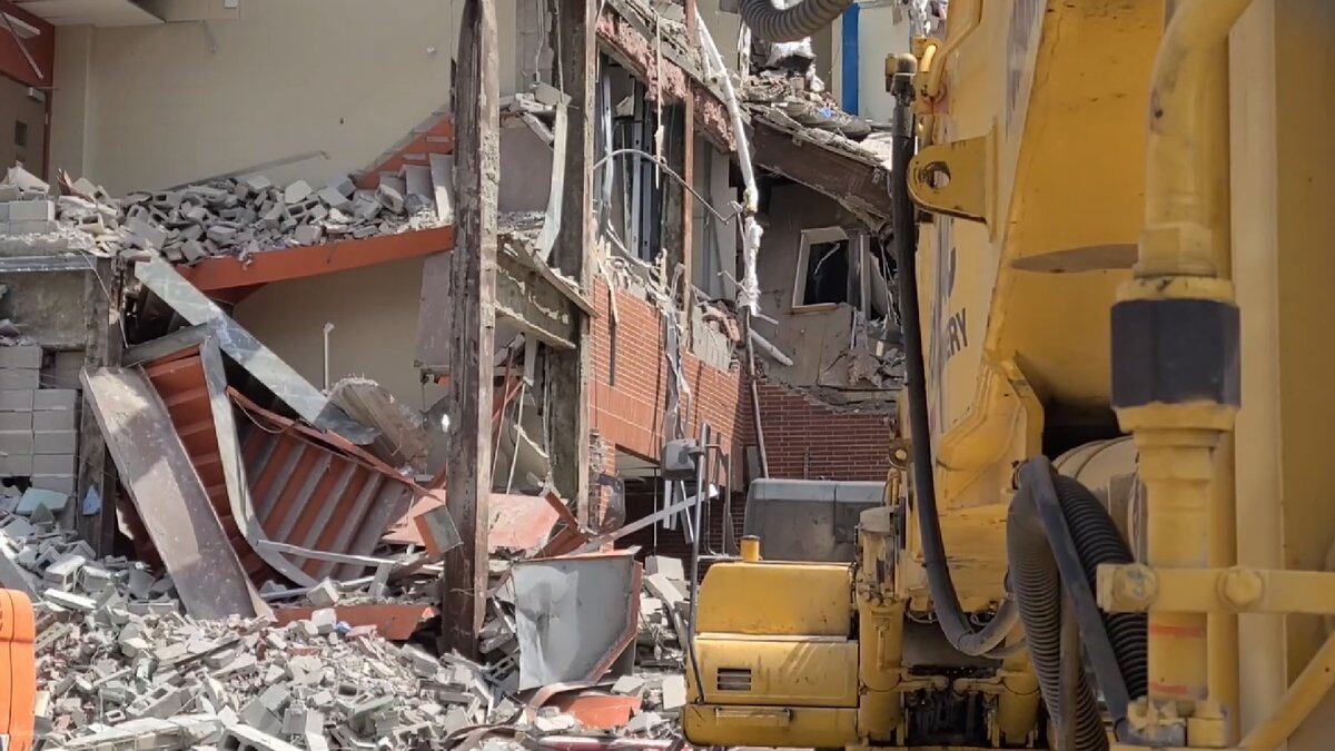Heavy machinery is tearing down the walls of the former St. Joe Hospital in downtown Fort Wayne.