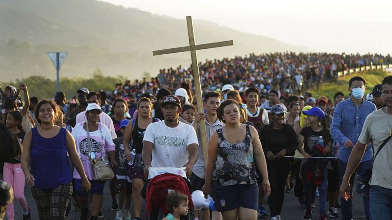 FILE - Migrants leave Huixtla, Chiapas state, Mexico, Oct. 27, 2021, as they continue their...