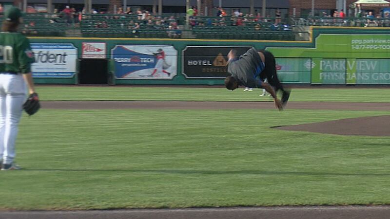 Nyheim Hines pulls off a back-flip after throwing a ceremonial first pitch at Parkview Field.
