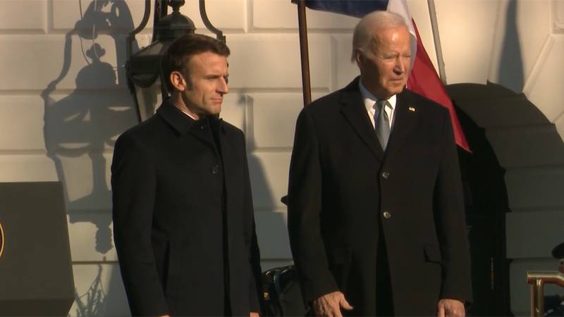 French President Emmanuel Macron and U.S. President Joe Biden watch an arrival ceremony at the...