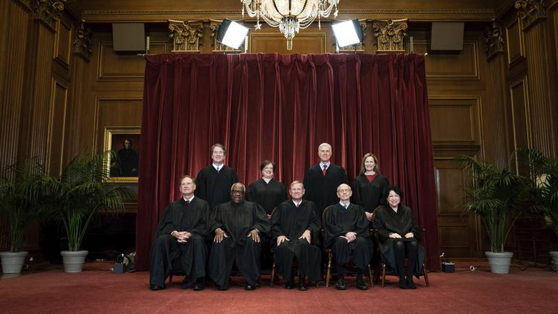 FILE - Members of the Supreme Court pose for a group photo at the Supreme Court in Washington,...