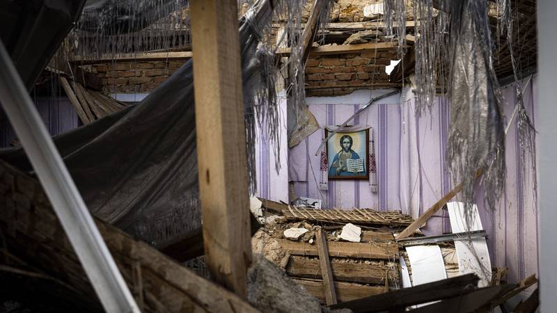 A religious icon is seen from the window of a church which was destroyed after Russian attack...