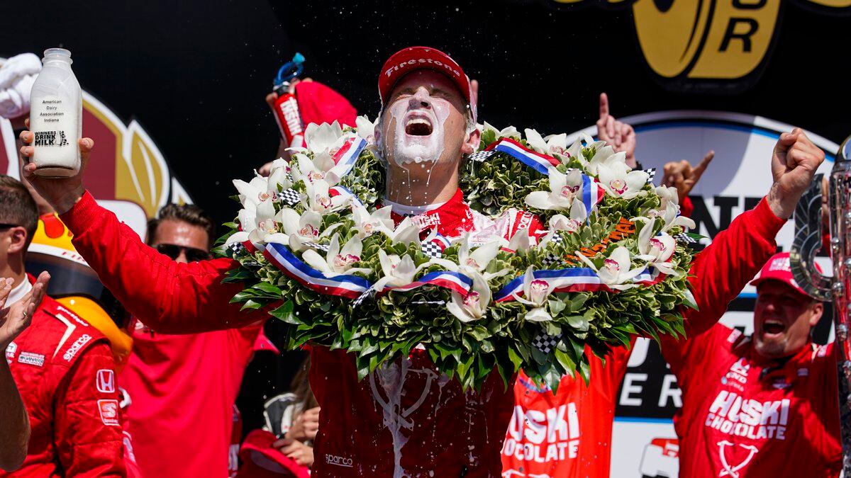 Marcus Ericsson, of Sweden, celebrates after winning the Indianapolis 500 auto race at...