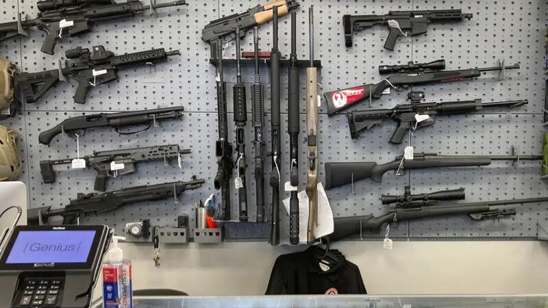 Firearms are displayed at a gun shop in Salem, Ore., on Feb. 19, 2021. A federal judge in...