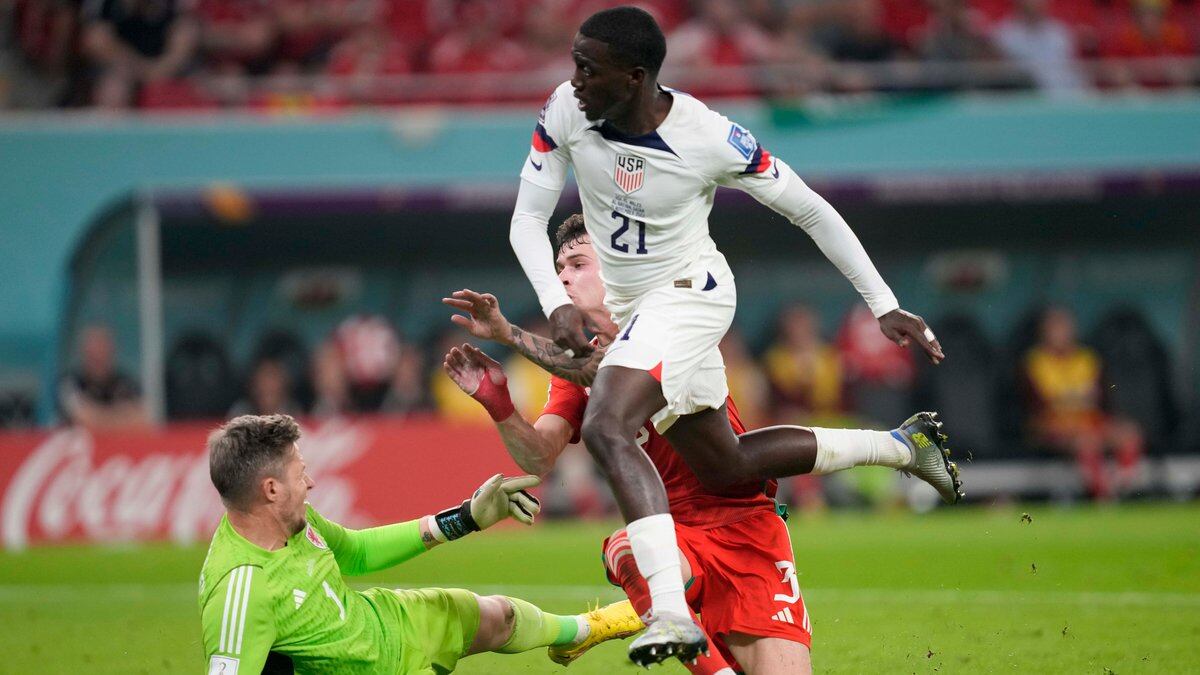 Tim Weah of the United States scores during the World Cup, group B soccer match between the...
